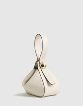 The Sculpted Metal Wristlet Bag VINTAGE MUSLIN