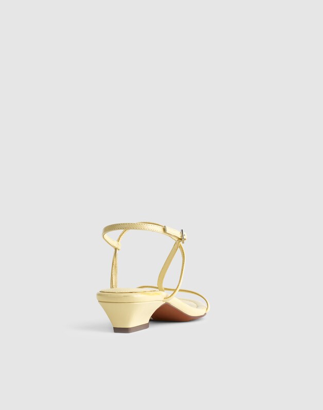 The Maycie Asymmetric T-Strap Sandal in Patent Leather PALE PINEAPPLE